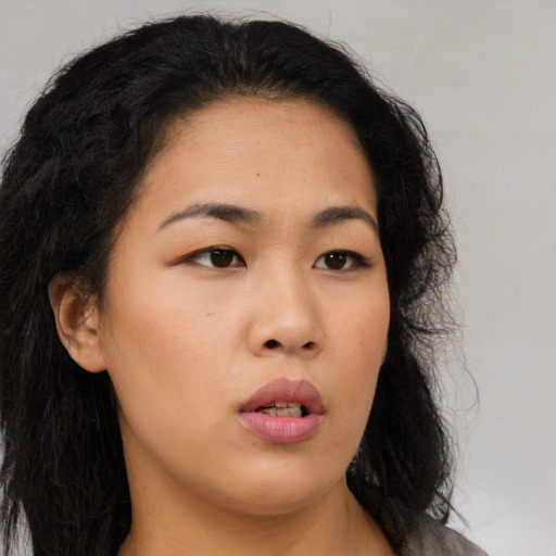 Neutral asian young-adult female with long  brown hair and brown eyes