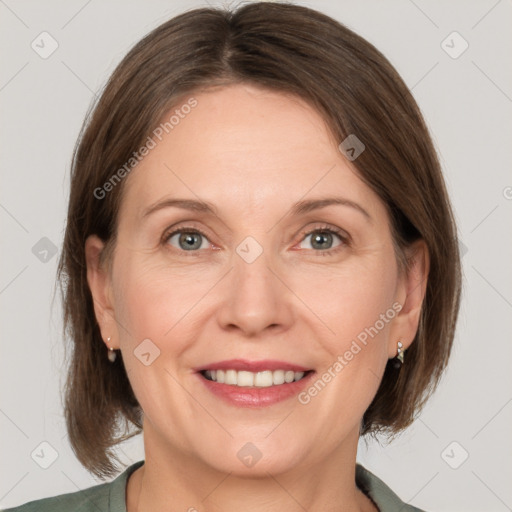 Joyful white adult female with medium  brown hair and grey eyes