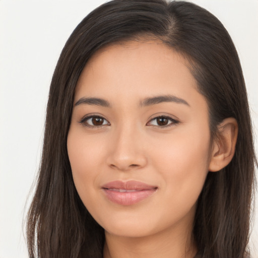 Joyful latino young-adult female with long  brown hair and brown eyes