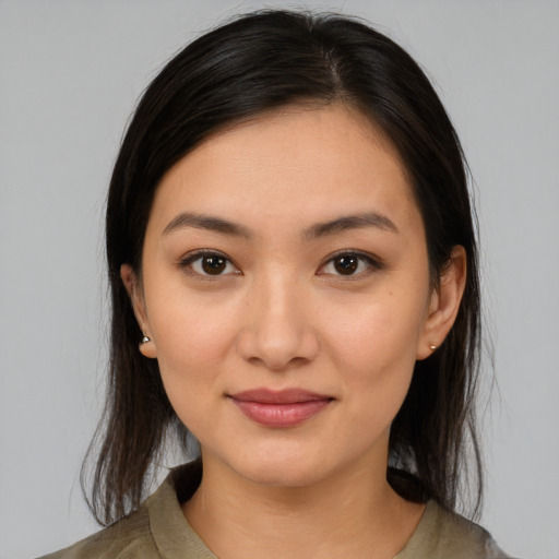 Joyful white young-adult female with medium  brown hair and brown eyes