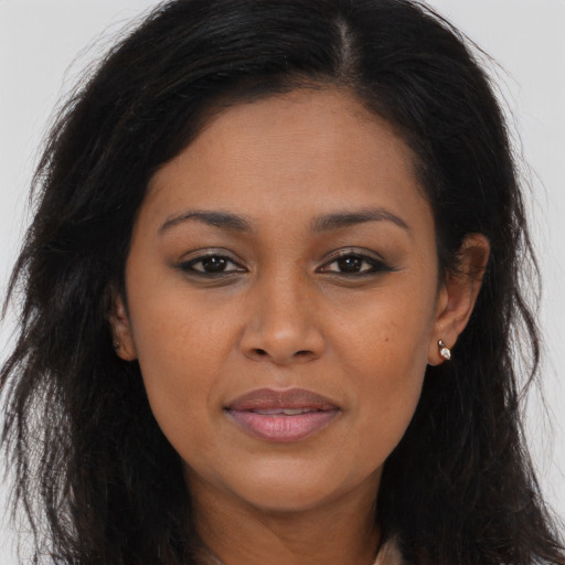 Joyful asian young-adult female with long  brown hair and brown eyes