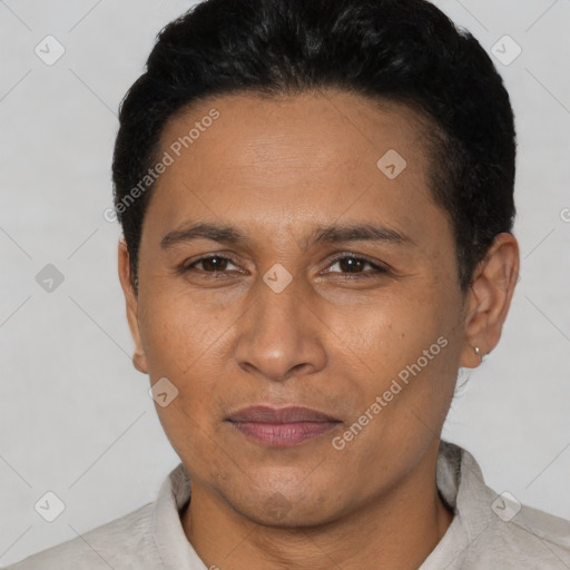 Joyful latino adult male with short  black hair and brown eyes