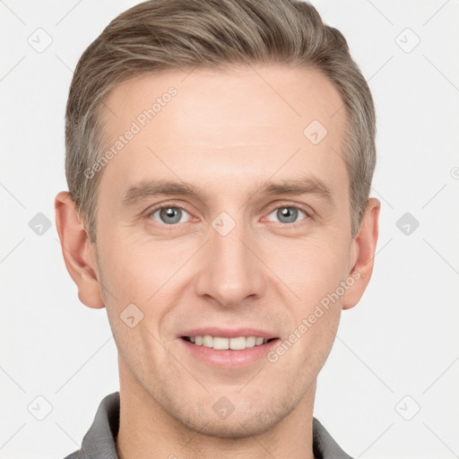 Joyful white adult male with short  brown hair and grey eyes