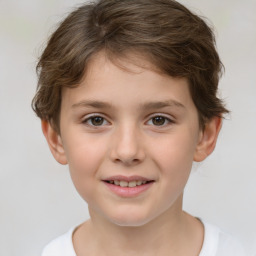 Joyful white child female with short  brown hair and brown eyes