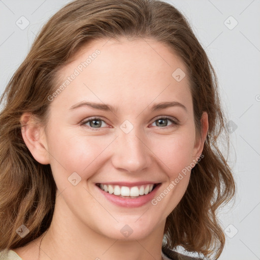 Joyful white young-adult female with medium  brown hair and blue eyes