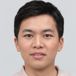 Joyful asian young-adult male with short  brown hair and brown eyes