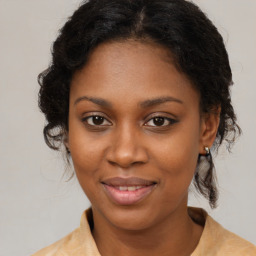 Joyful black young-adult female with medium  brown hair and brown eyes