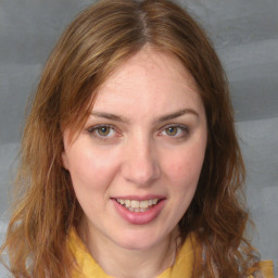 Joyful white young-adult female with medium  brown hair and blue eyes