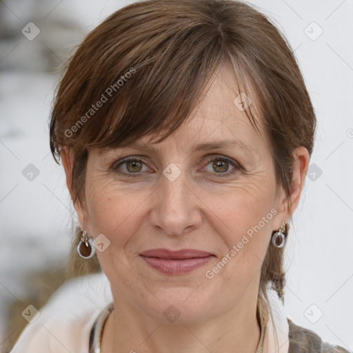 Joyful white adult female with medium  brown hair and grey eyes