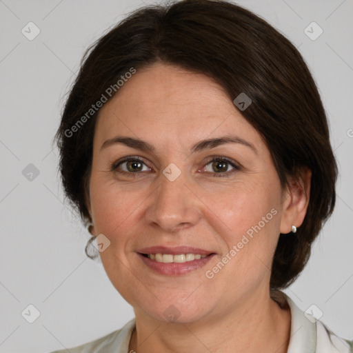 Joyful white adult female with medium  brown hair and grey eyes