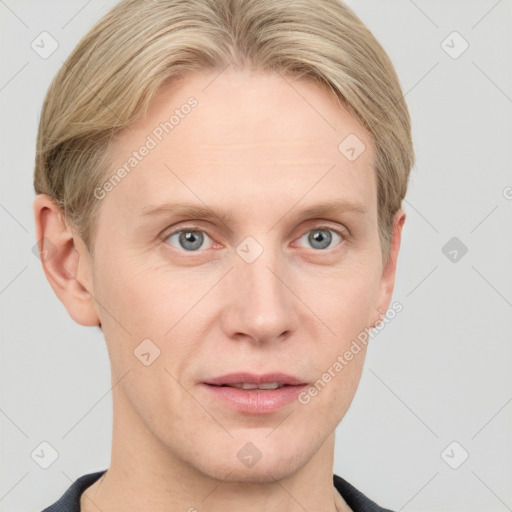 Joyful white adult male with short  brown hair and grey eyes