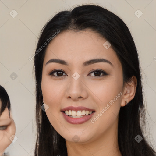 Joyful asian young-adult female with long  black hair and brown eyes