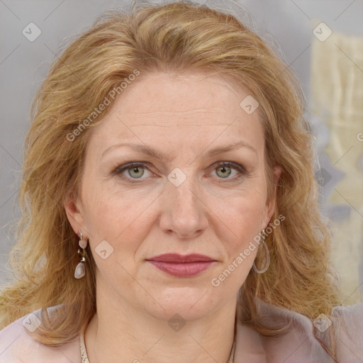 Joyful white adult female with medium  brown hair and blue eyes