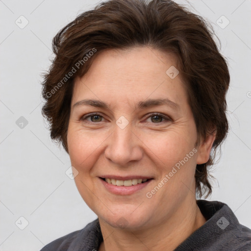 Joyful white adult female with short  brown hair and brown eyes