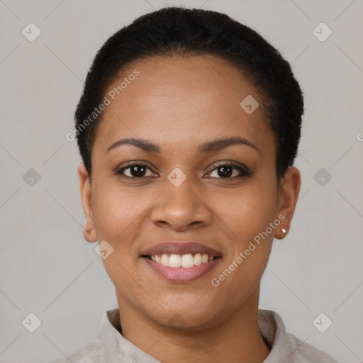 Joyful latino young-adult female with short  black hair and brown eyes