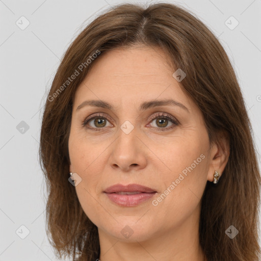 Joyful white adult female with long  brown hair and brown eyes