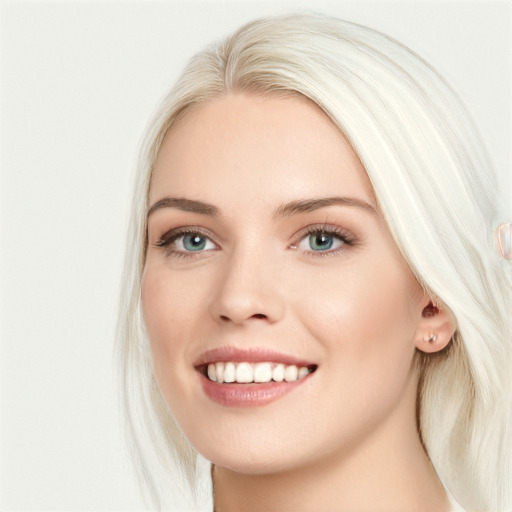 Joyful white young-adult female with long  brown hair and blue eyes