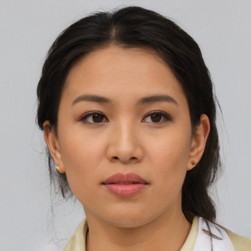 Neutral latino young-adult female with medium  brown hair and brown eyes
