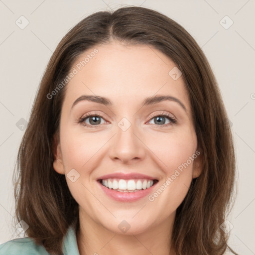 Joyful white young-adult female with medium  brown hair and green eyes