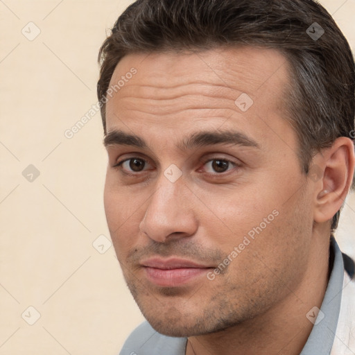 Joyful white young-adult male with short  brown hair and brown eyes