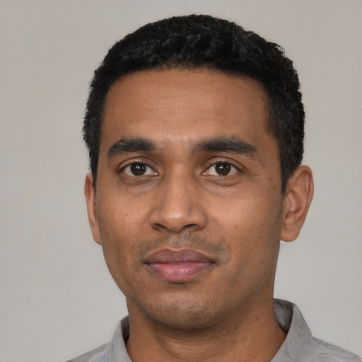 Neutral black young-adult male with short  black hair and brown eyes