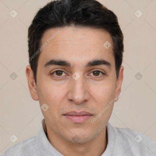 Joyful white young-adult male with short  brown hair and brown eyes