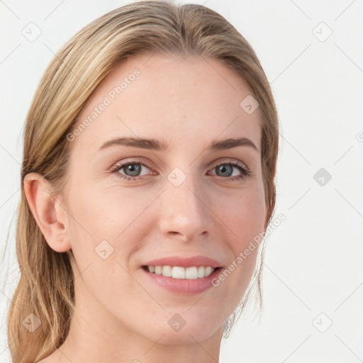 Joyful white young-adult female with long  brown hair and blue eyes