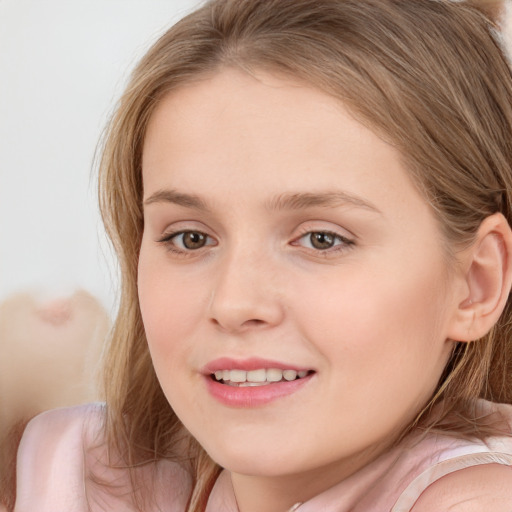 Joyful white child female with long  brown hair and grey eyes