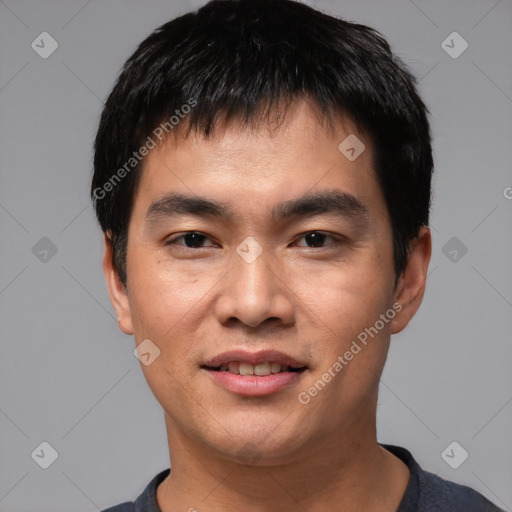 Joyful asian young-adult male with short  black hair and brown eyes