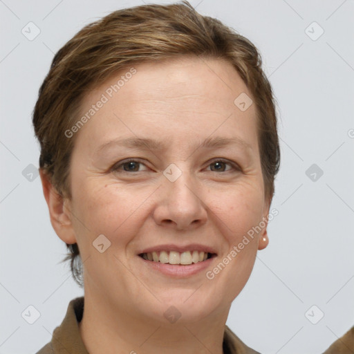 Joyful white adult female with short  brown hair and grey eyes