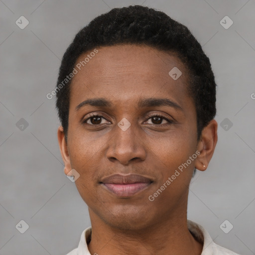 Joyful black adult male with short  black hair and brown eyes