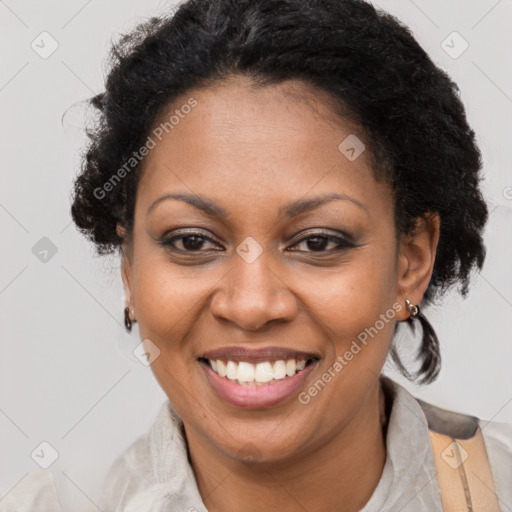 Joyful black adult female with short  brown hair and brown eyes