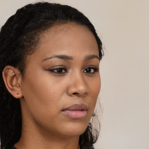 Neutral black young-adult female with long  black hair and brown eyes