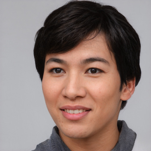 Joyful asian young-adult male with medium  black hair and brown eyes