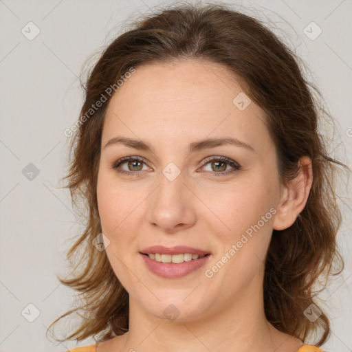 Joyful white young-adult female with medium  brown hair and green eyes