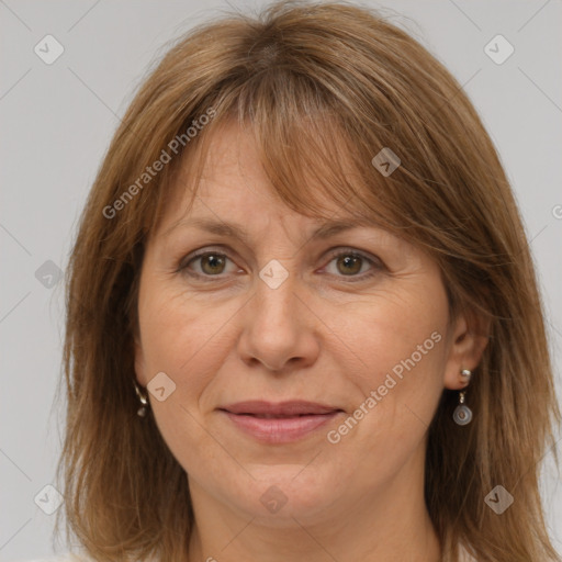 Joyful white adult female with medium  brown hair and grey eyes