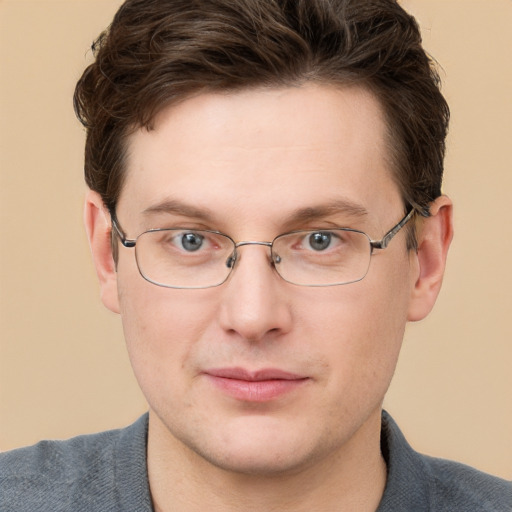 Joyful white adult male with short  brown hair and grey eyes