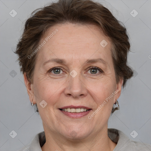 Joyful white adult female with short  brown hair and grey eyes