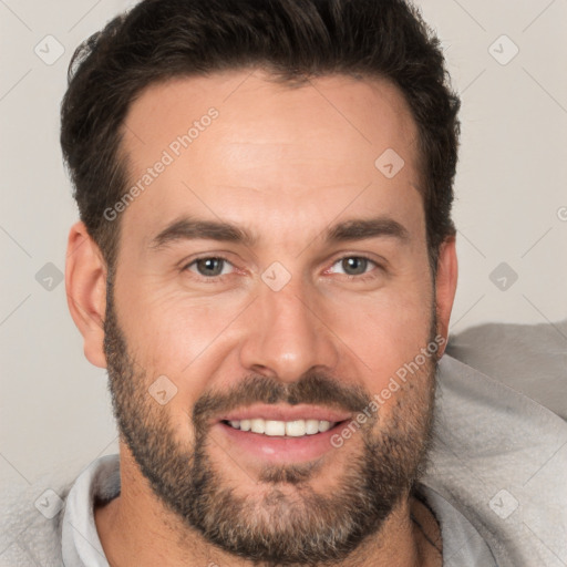 Joyful white adult male with short  brown hair and brown eyes