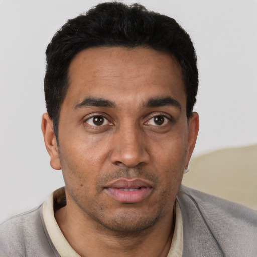 Neutral white young-adult male with short  black hair and brown eyes
