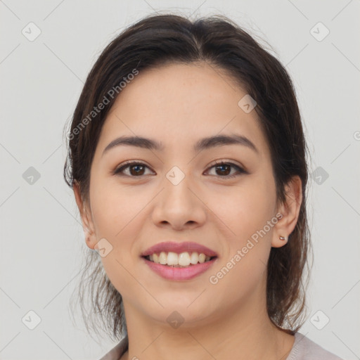 Joyful latino young-adult female with medium  brown hair and brown eyes