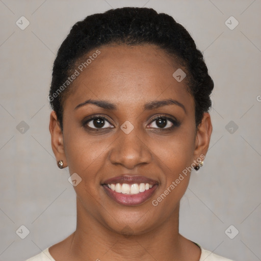 Joyful black young-adult female with short  black hair and brown eyes