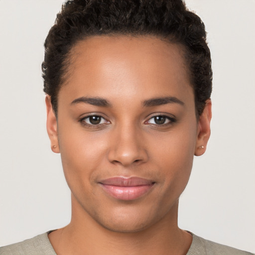 Joyful latino young-adult female with short  brown hair and brown eyes