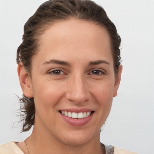 Joyful white young-adult female with medium  brown hair and brown eyes