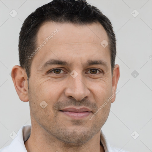 Joyful white adult male with short  brown hair and brown eyes