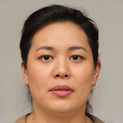 Neutral asian adult female with medium  brown hair and brown eyes