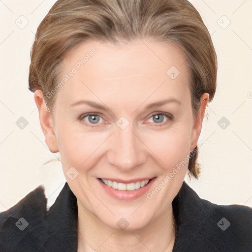 Joyful white adult female with medium  brown hair and brown eyes