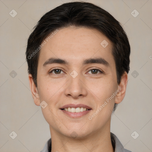 Joyful white young-adult male with short  black hair and brown eyes