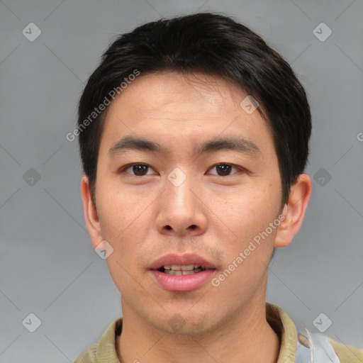 Joyful asian young-adult male with short  brown hair and brown eyes