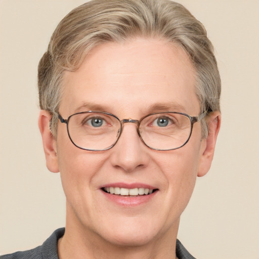 Joyful white adult male with short  brown hair and blue eyes